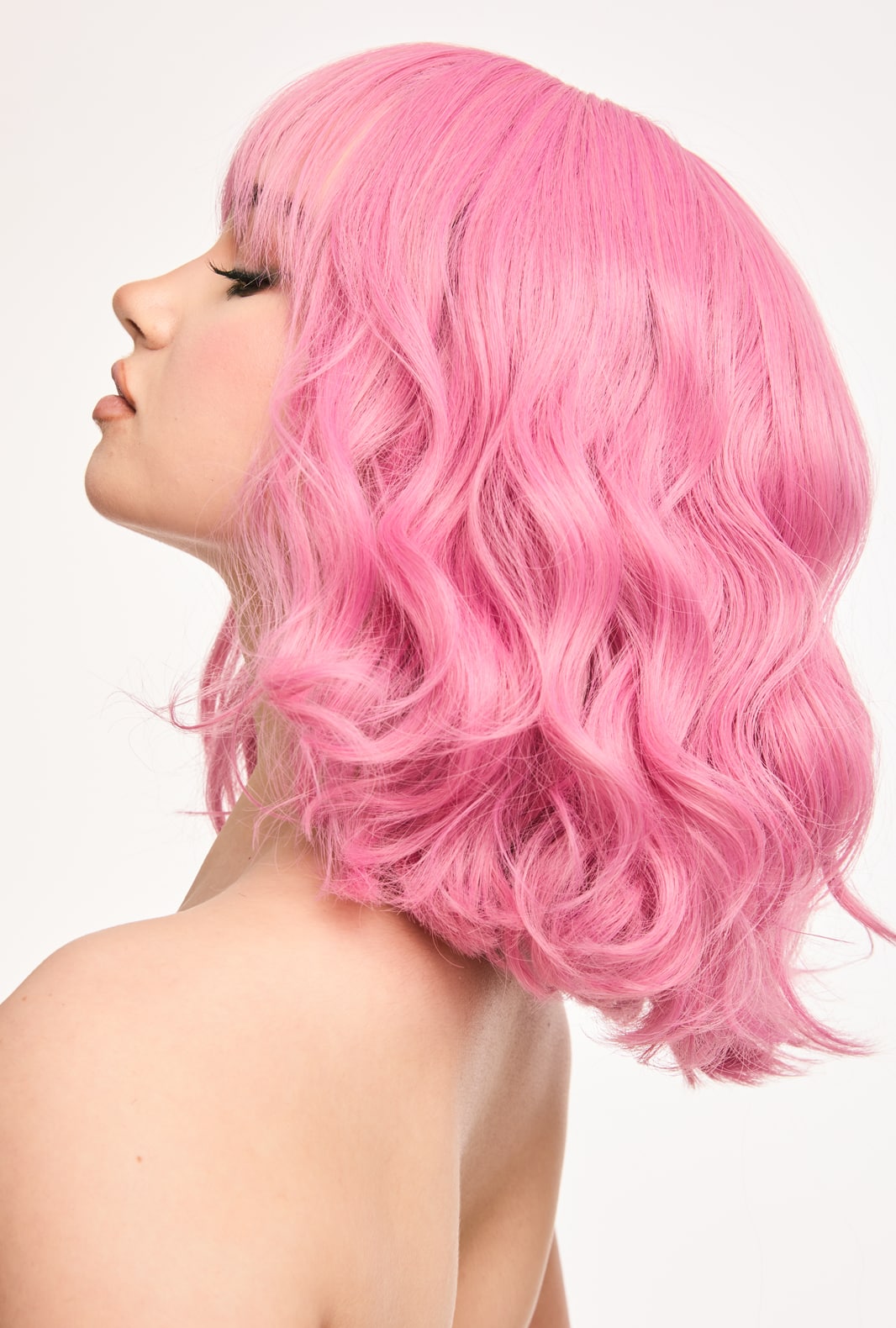 Petal | Youthful Pink Curly Synthetic Wig with Bangs - Ailsa's Wigs